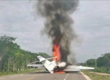 A plane burns down after landing on a Mexico highway carrying drugs