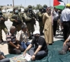 Preventing citizens from conducting Friday prayers on their lands threatened with confiscation in Haris