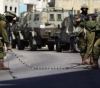 Sealing off the city of Qalqilya with heavy military checkpoints