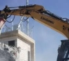 The occupation demolishes an apartment building under construction in Jabal Al-Mukaber, Jerusalem