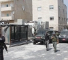 The occupation arrests a young man and summons an activist for investigation from Al-Issawiya