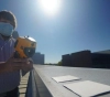 Coating material to cool down surfaces in direct sunlight