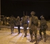 The occupation arrests 13 citizens, including two brothers