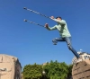 A boy from Gaza shot by the occupation forces defies disability with parkour sport