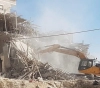 The occupation threatens to demolish an apartment building and two houses north of Nablus