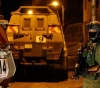 The arrest of a citizen and raids in the West Bank