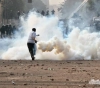 Two young men were wounded and dozens of suffocated, in clashes in Kafr Malik