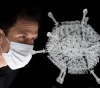 An artist creates a glass sculpture of the AstraZeneca vaccine