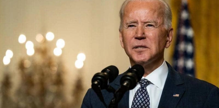 Biden signs an executive order that facilitates the voting process on the anniversary of the crackdown on a civil rights march
