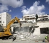 On the pretext of not authorizing.. Israeli occupation destroys residential building in Jerusalem