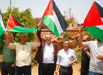 The start of a march to raise the Palestinian flags in Qalqilya