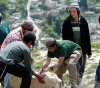 Israeli settlers remove the agricultural land gate near Bethlehem