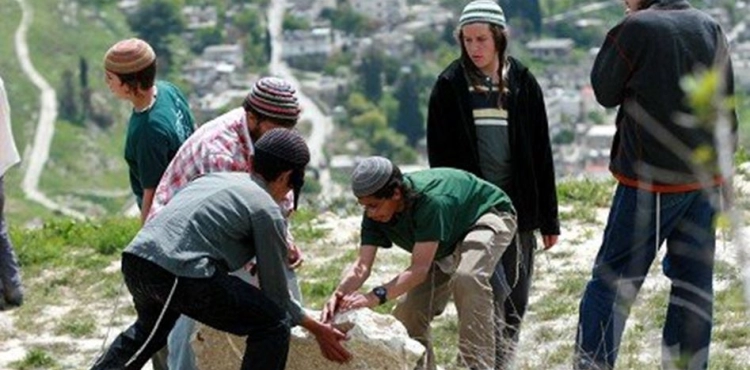 Israeli settlers remove the agricultural land gate near Bethlehem