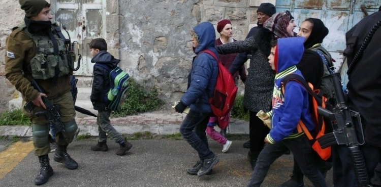 The occupation forces detain students and teachers of a school in Hebron