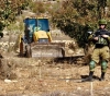 The occupation bulldozed 8 dunums of Palestinian lands north of Ramallah