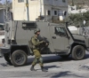 The occupation closes the iron gate at the entrance to the village of Haris