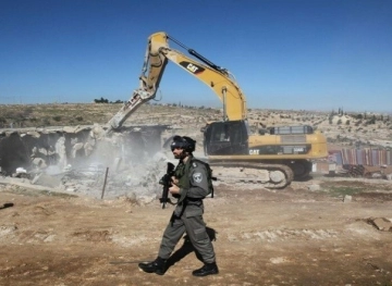 The occupation demolishes a house in the occupied interior