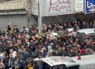 Thousands mourn the bodies of the three martyrs in Jenin