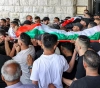 Crowds mourn the bodies of the three martyrs in Nablus