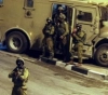 The occupation raids shops in the village of Al-Arqa, west of Jenin