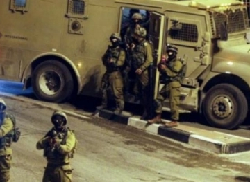 The occupation raids shops in the village of Al-Arqa, west of Jenin