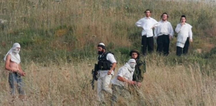 Clashes during an attack by settlers in Qasra